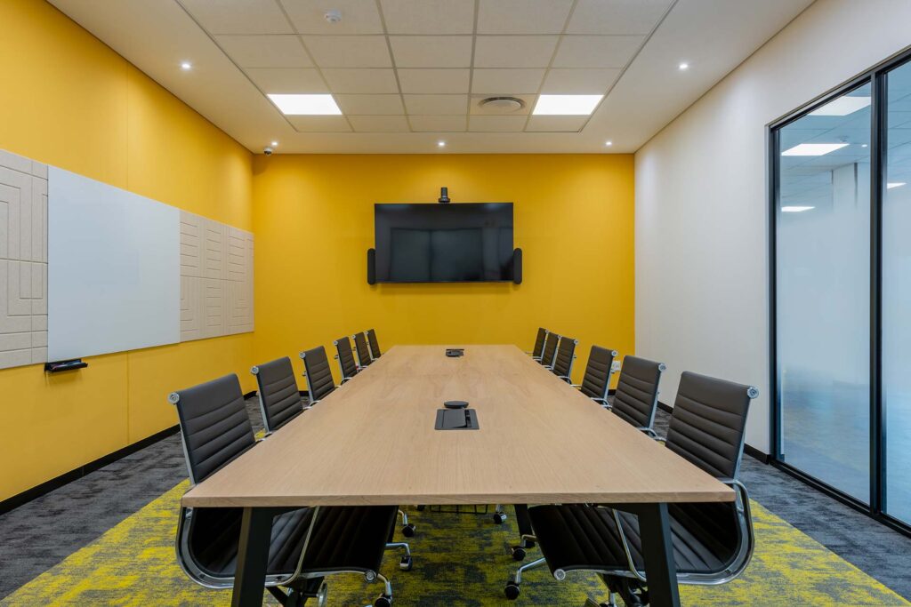 Call centre boardroom with comfortable executive seating and a large modern meeting table, showcasing premium corporate furniture