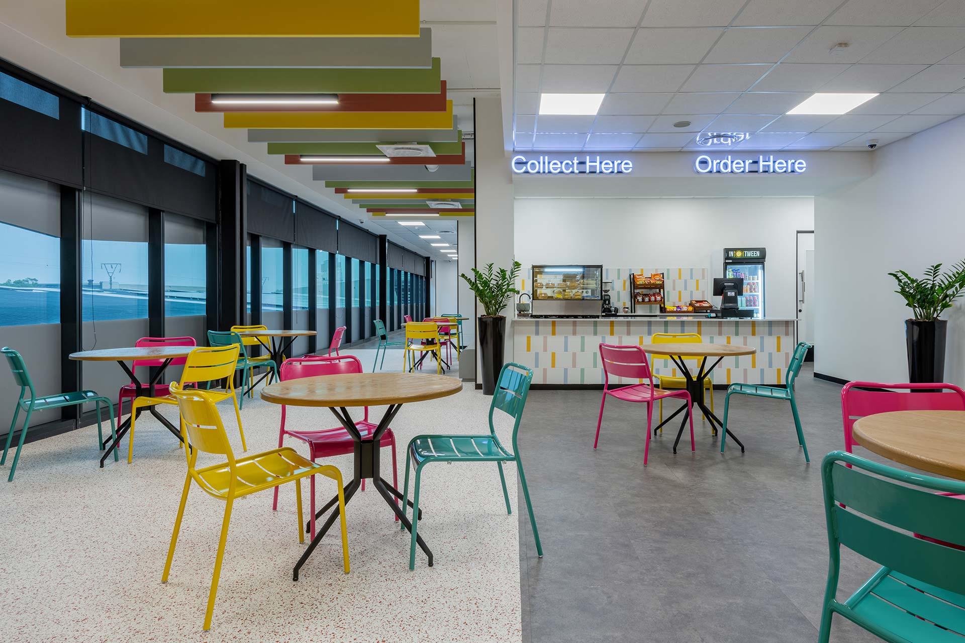 Call centre canteen and deli area with contemporary chairs, tables and custom serving counter, showcasing commercial furniture sourcing