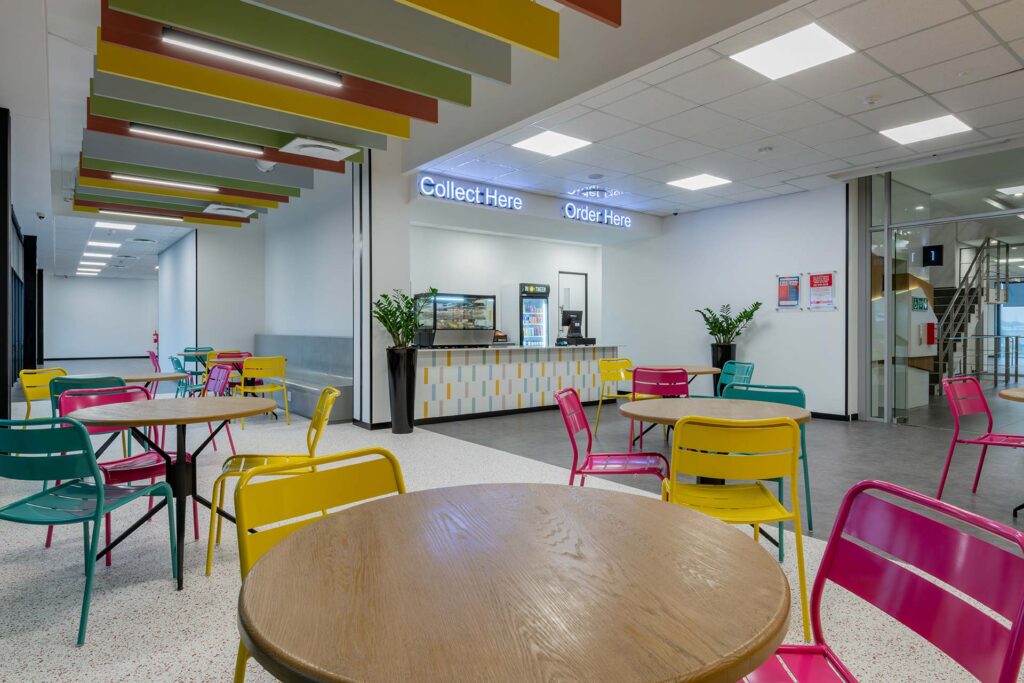 Cape Town call centre canteen with colourful chairs, showcasing contemporary workplace furniture and FF&E procurement