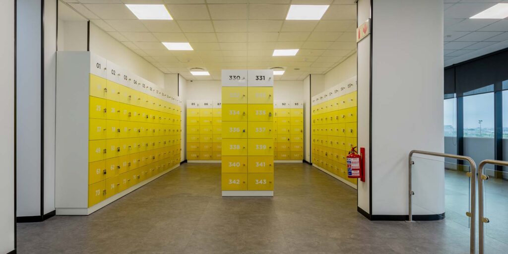 Call centre canteen with bright yellow lockers and custom-coloured furniture, creating an energetic and welcoming workplace environment