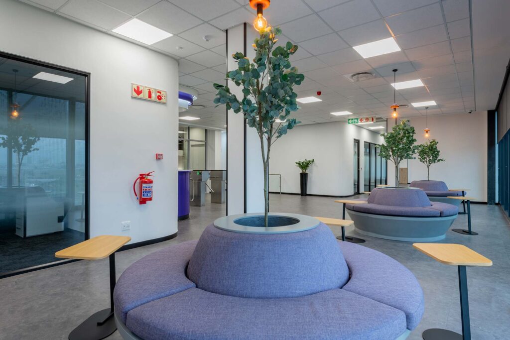 Cape Town Black River Park call centre waiting area with modern purple furniture and curved round bench seating, showcasing commercial FF&E solutions