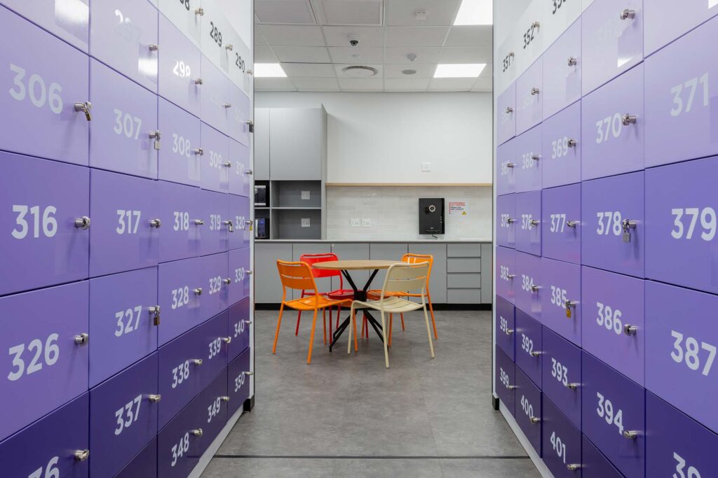 Cape Town Black River Park call centre with purple lockers, contemporary chairs and tables, showcasing workplace furniture procurement