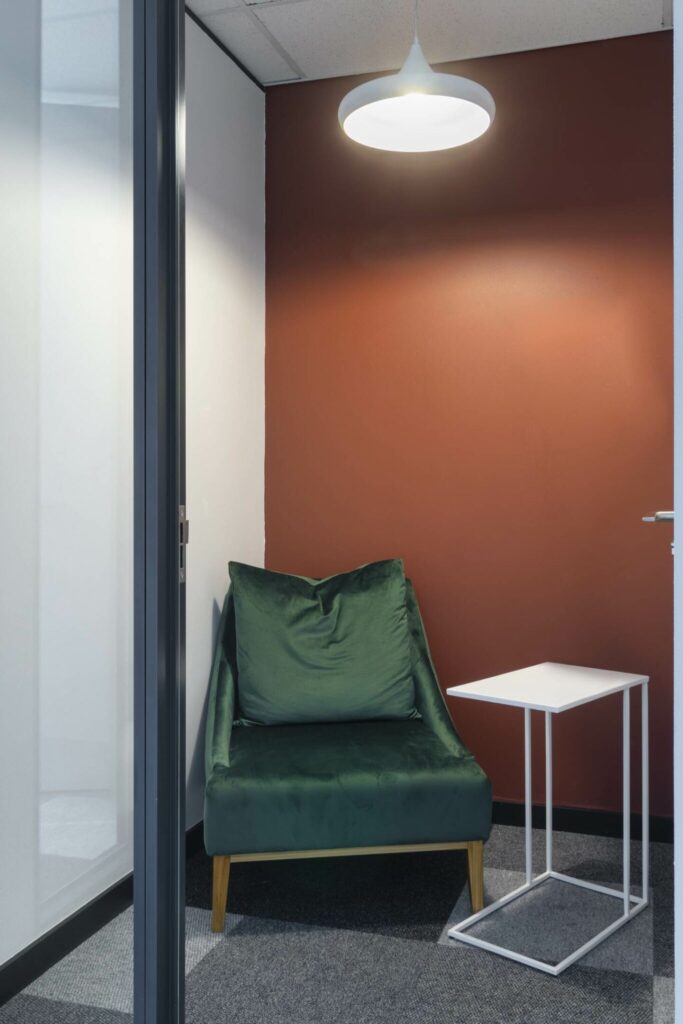 DHL office showcasing comfortable seating and laptop tables for phone booths.
