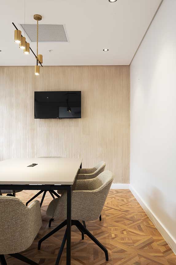 Letsema audiovisual room: office furniture installation with neutral furnishings, glamorous office chairs, and AV setup.