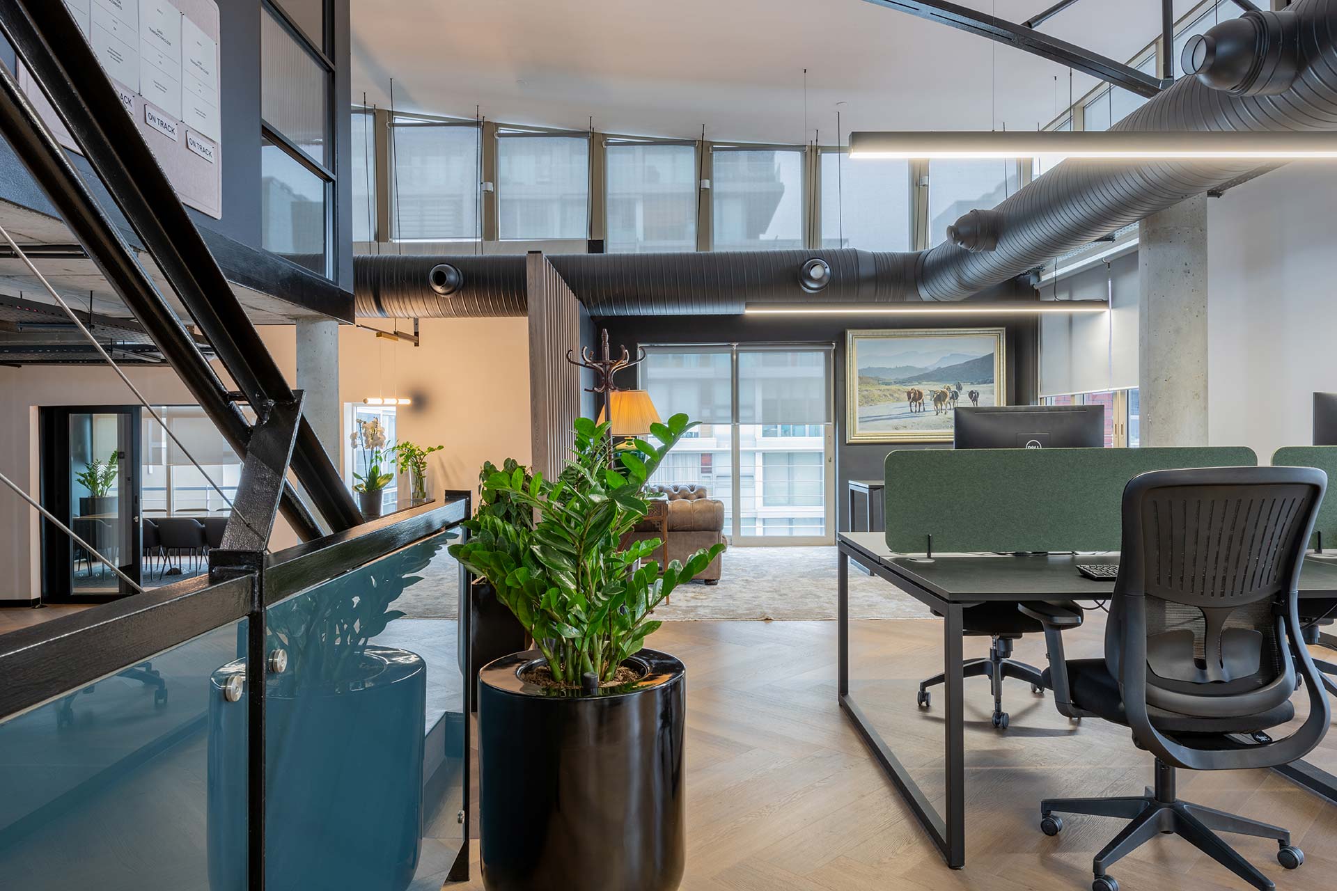 Lion Capital Cape Town open-plan office with modular desks, ergonomic chairs, desk partitions and integrated planters, showcasing premium workplace furniture procurement