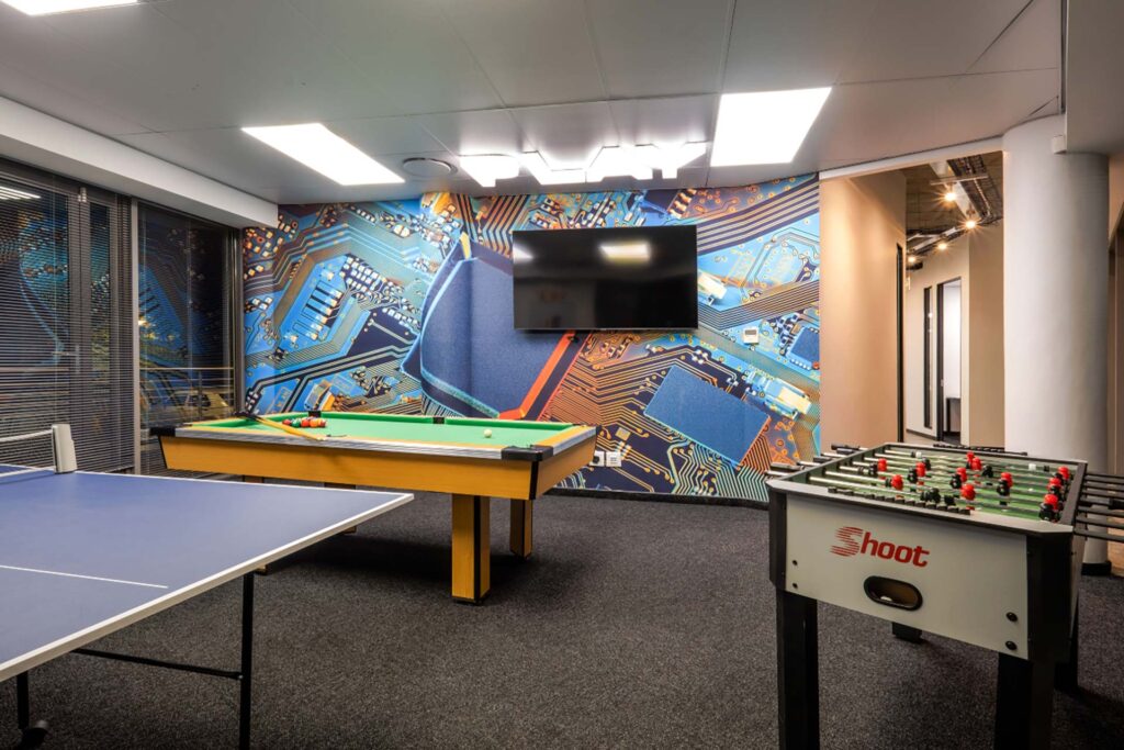 Mazars Johannesburg canteen furniture; games room with foosball and ping-pong tables.
