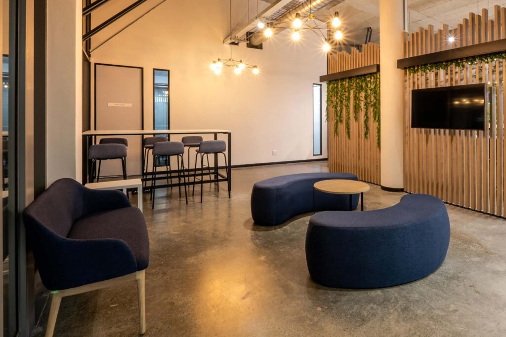 Mazars Johannesburg: Custom-made curved ottomans, sofas, and coffee tables for corporate furnishings.