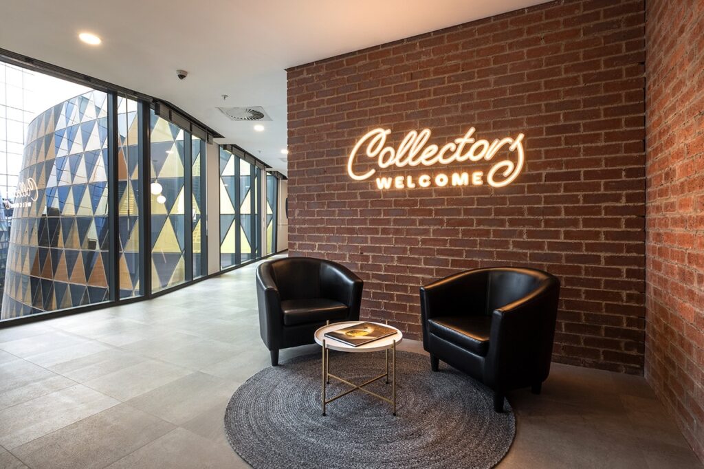 Modern leather reception area seating with a small gold coffee table.