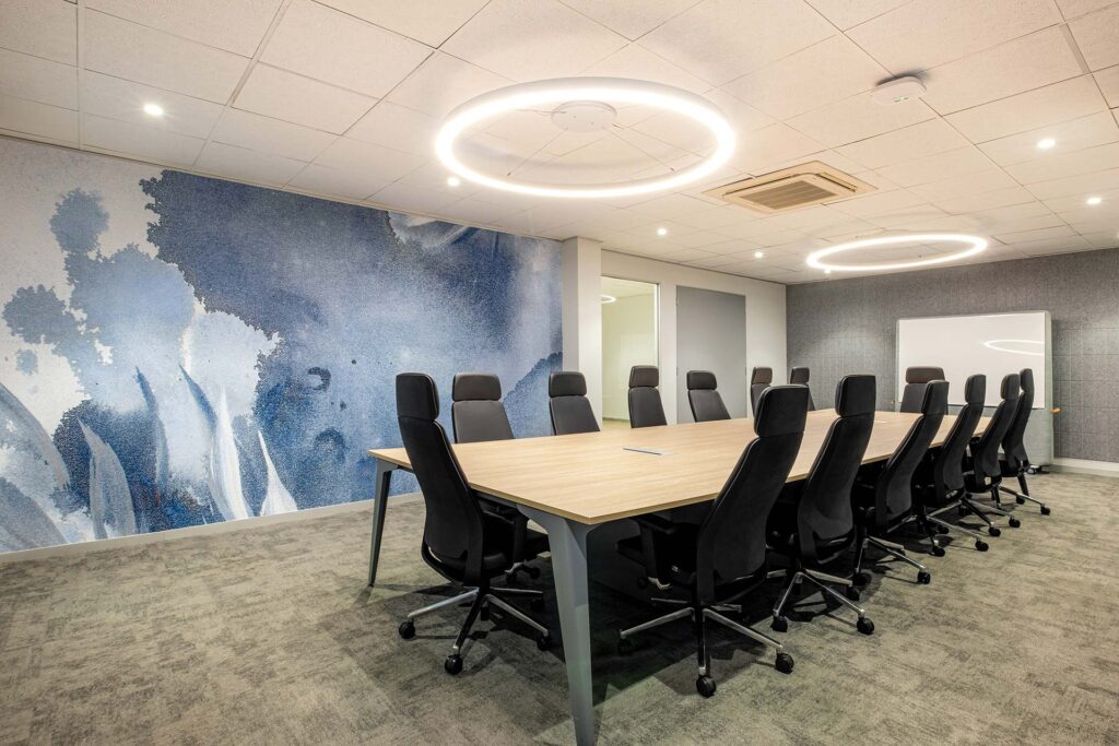 Sanlam Houghton boardroom with timber table and high-backed chairs, showcasing premium workplace furniture