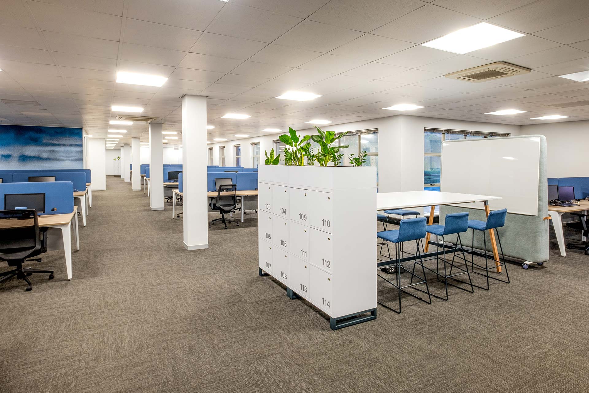 anlam Houghton large open-plan office with modular desks, bar stools, locker systems and whiteboards, showcasing furniture procurement