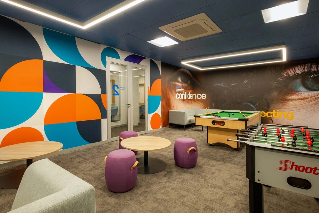 Sanlam Houghton canteen and games area with ottoman seating, round tables and pool table