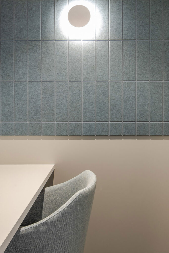 Sanlam Houghton focus booth with acoustic panels, custom fabric chair and desk, showcasing flexible office furniture