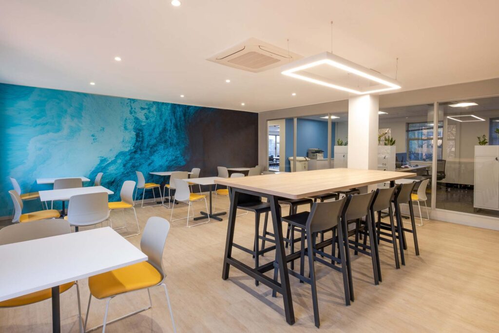 Sanlam Houghton open-plan canteen with mixed dining furniture and vibrant seating