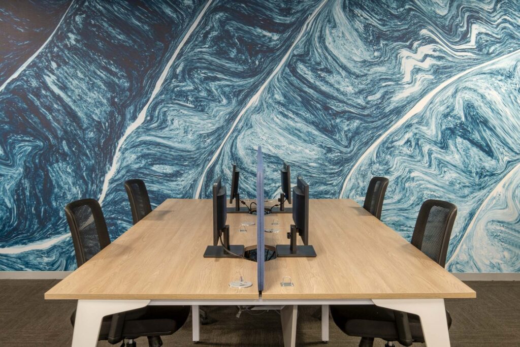 Sanlam Houghton open-plan office with shared desks and ergonomic seating, showcasing flexible workplace furniture solutions