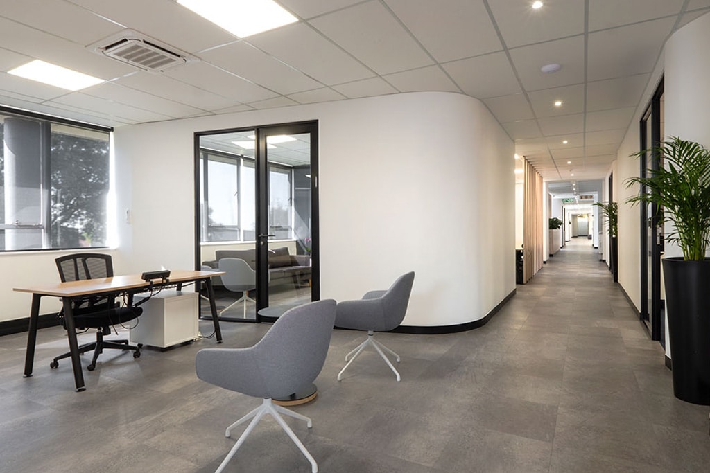 Snowsoft office workspace with modern desks, varied task chairs and practical desk accessories, showcasing flexible office furniture procurement