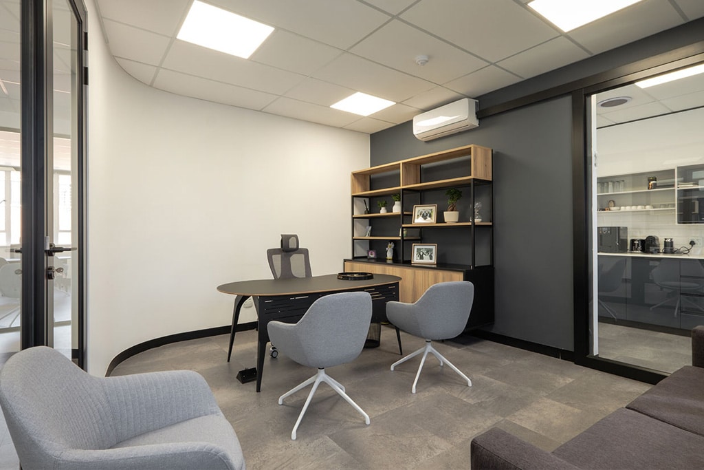 Snowsoft modern office with contemporary chairs, tables, shelving, curved desks, couches and comfortable visitor seating, showcasing independent furniture solutions