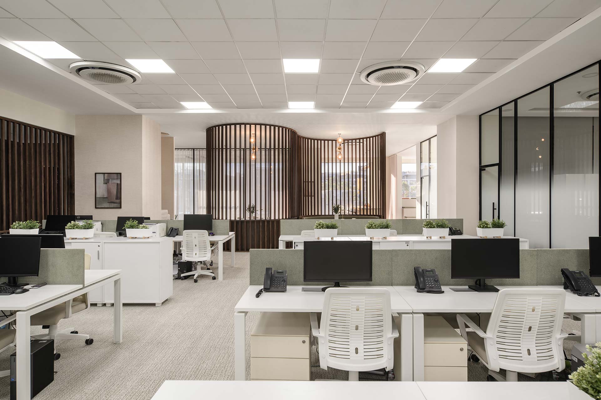 Soma Bay Cairo large open-plan office with shared white desks, ergonomic chairs, screen partitions and custom fabric finishes