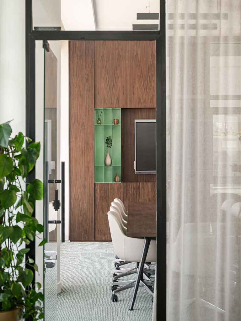 Soma Bay Cairo luxury meeting room with boardroom chairs, glass walls and custom timber wall unit cladding