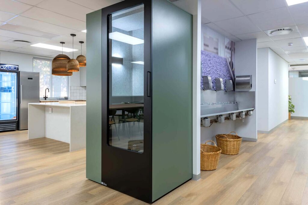 United Exports Paarl office with acoustic phone booth, contemporary fit-out and kitchenette, showcasing flexible FF&E solutions.