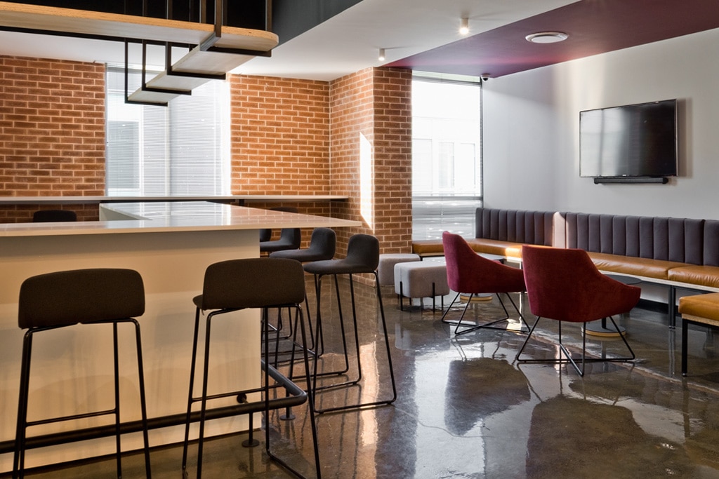 VO Connect office with barstools, visitor chairs and contemporary desks, showcasing specialist furniture procurement services