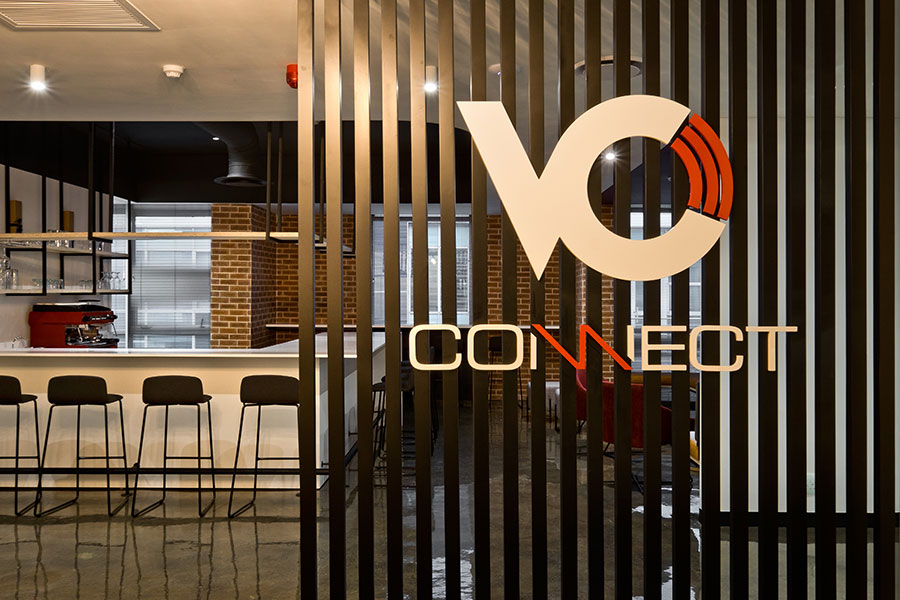 VO Connect office with modern black barstools and high table for a contemporary canteen and breakout area