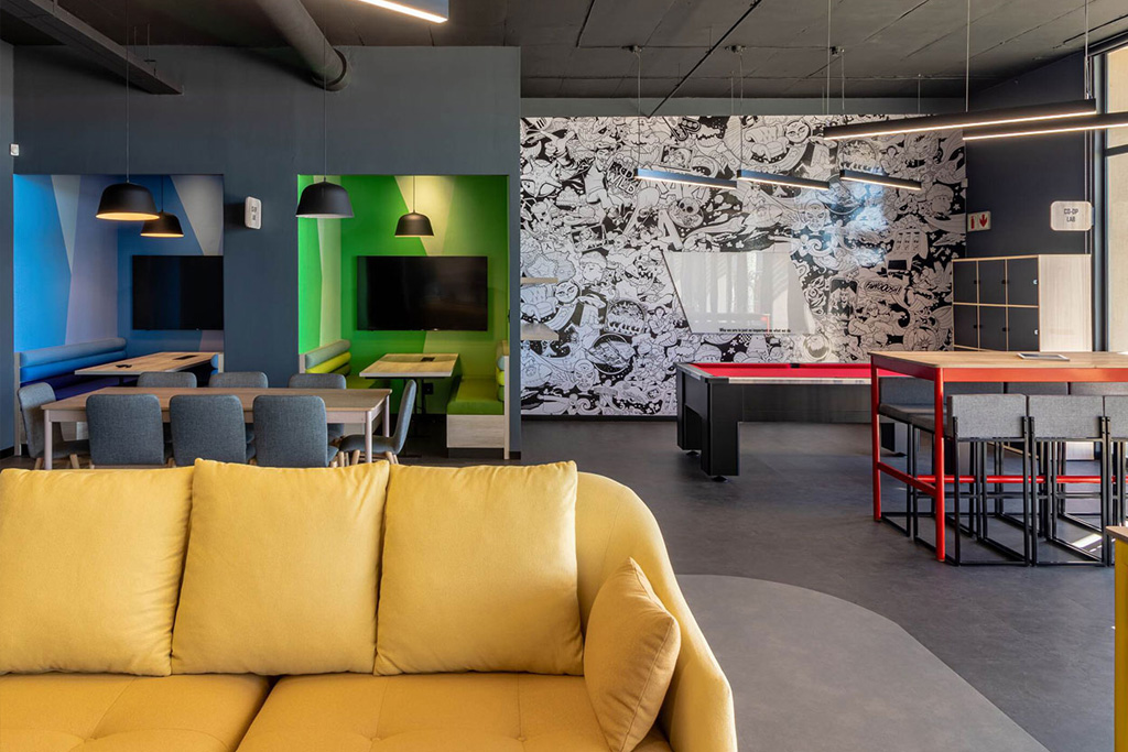 Wonderlabz Cape Town staff entertainment area with colourful booths, games table and flexible seating, showcasing specialist FF&E procurement