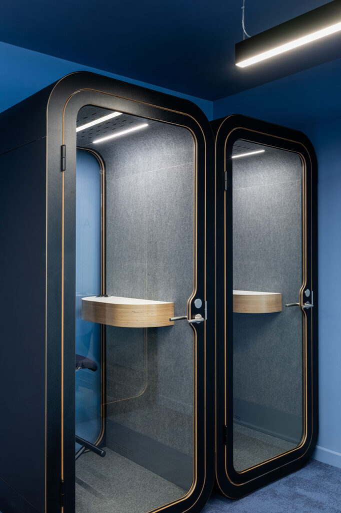 British Airways Euroflyer London office with custom acoustic pods and integrated lighting, showcasing tailored FF&E furniture solutions